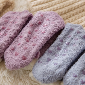 Thick coral fleece thermal socks for women with non-slip heart patterns on the bottom