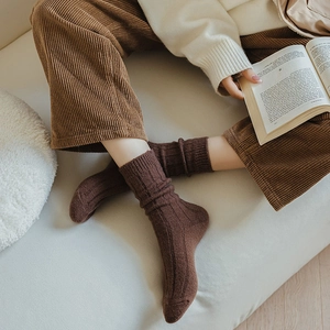 Close-up of brown ribbed wool socks with natural texture and warm knitted aesthetic