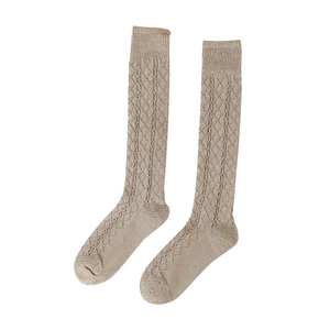 Oatmeal knit knee-high socks with vintage diamond cable pattern and ribbed cuffs