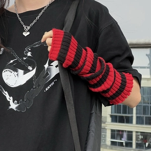 Detail of red and black striped knitted arm warmers in chunky knit lolita jk style