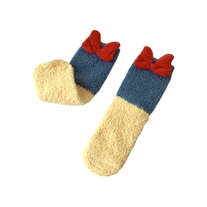 Navy and cream coral fleece socks with plush material and red bows for winter home wear