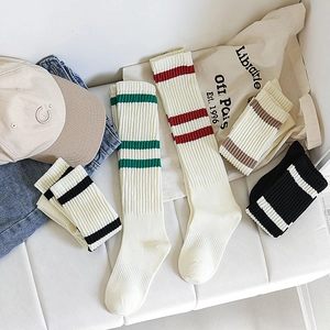 Japanese style white knee high socks with striped patterns for a classic school look