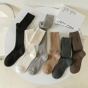 Detailed knit texture of over-the-knee wool socks in six various neutral earth tones