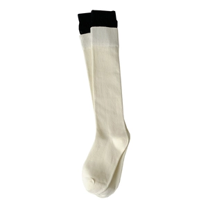 White knee-high slouch socks with black double-layered ribbed cuffs in minimalist style