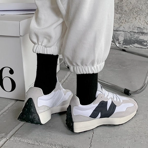 Detailed back view of vintage-style sneakers featuring iconic studded rubber outsole