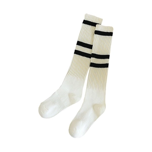 Japanese style white knee-high socks with black stripes and ribbed knit texture