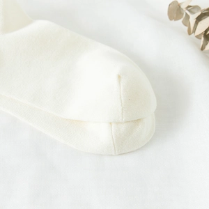 Detail view showing smooth seamless toe stitching of white Lolita style cotton socks