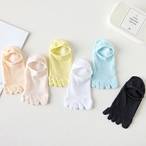 Detail of colorful cotton five-finger liner socks with breathable mesh texture