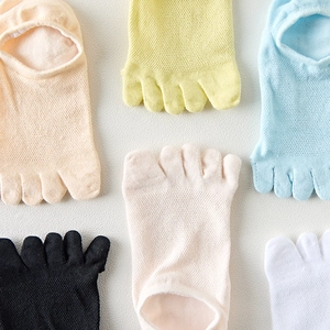 Close-up of multicolored five-finger toe socks with breathable cotton mesh texture