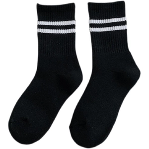 Mid-calf checkerboard crew socks in black with white stripes and ribbed cotton finish