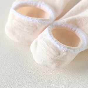 Macro view of non-slip silicone strips on the heel of pink invisible five-finger socks