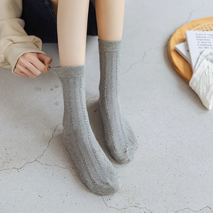 Japanese retro style light grey mid-calf cotton socks with diamond knit pattern in home setting
