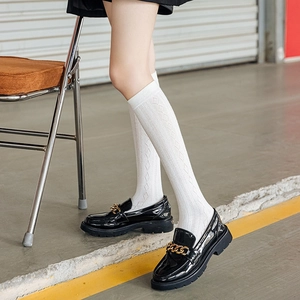 Japanese Lolita high socks in white diamond knit pattern styled with black loafers