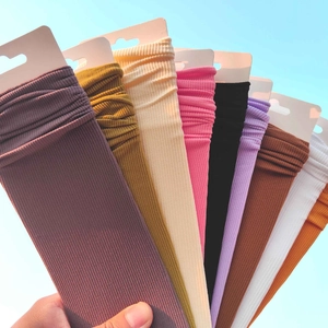Vertical ribbed knit candy-colored slouch socks in various colors with retail labels
