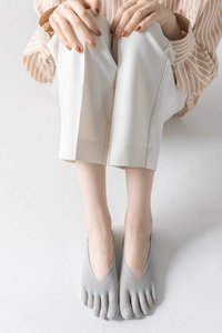 Close-up of gray five-finger invisible socks with breathable knit fabric and low cut