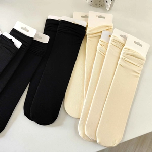 Black and cream ribbed velvet mid-calf socks with breathable JK style texture