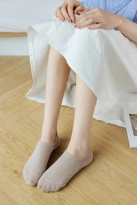 Close-up of beige breathable mesh invisible socks with reinforced toe for women