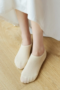 Close-up of beige low cut invisible socks with breathable mesh knit and seamless design