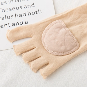 Detail of skin-tone five-finger socks showing padded forefoot for pressure relief
