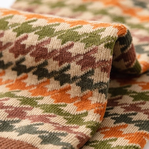 Detailed close-up of multi-color houndstooth knit texture on vintage cotton crew socks