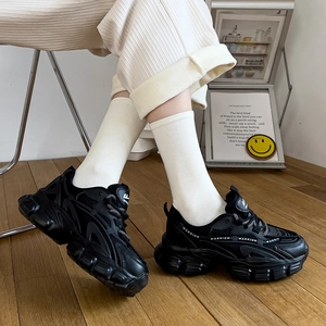 Retro black chunky sneakers with thick soles and white socks for women in trendy style