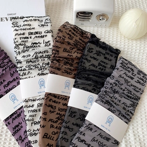 Japanese style sheer crew socks with graffiti print in five assorted colors on white cloth