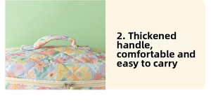 Detail of the thickened handle on the floral quilted makeup bag for comfortable carrying