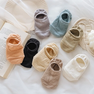 Close-up of mesh knit low-cut invisible boat socks in various colors with anti-slip heels