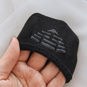 Detail of black breathable mesh sock showing anti-slip silicone grip on the inner heel
