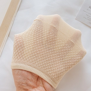 Close-up of beige breathable mesh boat socks showing thin transparent texture
