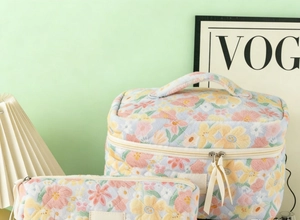 Detail of floral quilted cosmetic bag set featuring a soft texture and zipper closure