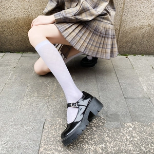 Black patent leather Mary Jane shoes with thick soles and white diamond pattern calf socks