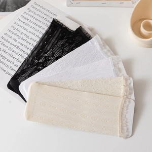 Detail of lace trim on white, black and beige hollow out mesh crew socks for women
