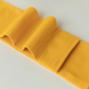 Macro detail of vertical ribbed texture on bright yellow elastic summer socks fabric