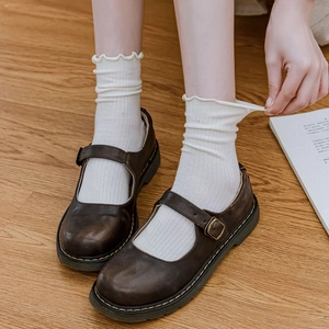 Japanese style split toe cotton socks with ruffle trim paired with brown leather shoes