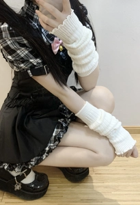 Detail of white ribbed knit leg warmers with Lolita style dress and Mary Jane shoes