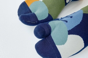 Close-up of geometric patterned cotton Tabi socks with unique split-toe design features