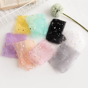 Flat lay of ultra-thin sheer mesh socks featuring gold star and moon sequins in 8 colors