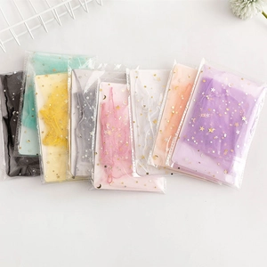 Colorful star and moon pattern organza gift bags in various colors for party favors