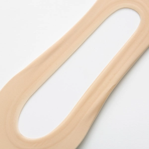 Macro detail of nude non-slip invisible socks with breathable wave texture surface
