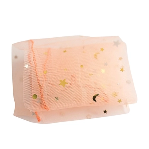 Sheer mesh drawstring gift bag with gold star and moon patterns in orange finish