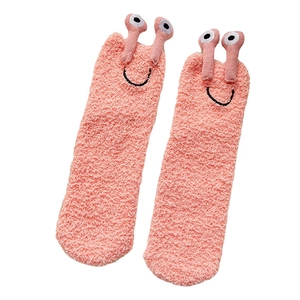 Cozy pink coral fleece socks with cute 3D snail cartoon eyes and warm plush texture