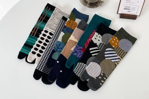 Detail view of seven pairs of cotton Tabi flip-flop socks with Japanese geometric patterns