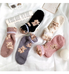 Detailed view of five-pack coral fleece bear socks in various soft autumn colors
