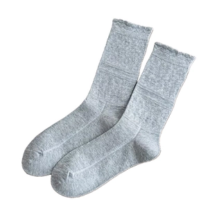 Light gray ruffle cuff crew socks for women with breathable knit texture and JK style
