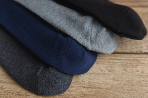 Detail of high-quality knit texture and toe stitching on four-color cotton knee socks