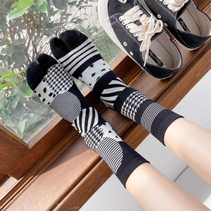 Japanese style Tabi socks with black and white geometric patterns and cotton knit texture