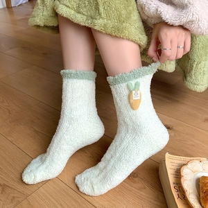 Cute white coral fleece winter socks with green fuzzy trim and rabbit carrot patch