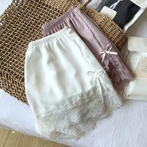 Close-up of lightweight ice silk safety shorts with delicate lace trim and side bows