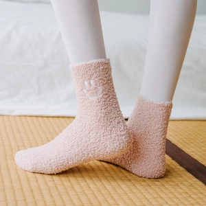 Thick pink coral fleece socks with embroidered smiley face for home winter comfort